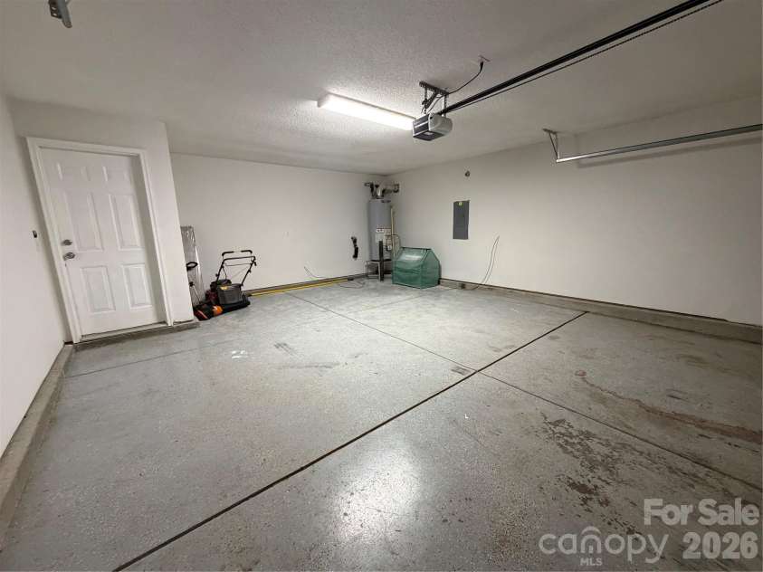 9233 Simonton Drive, Charlotte, NC 28269.  MLS# CAR4384205, YatesRealty ID 26481. 2 car garage