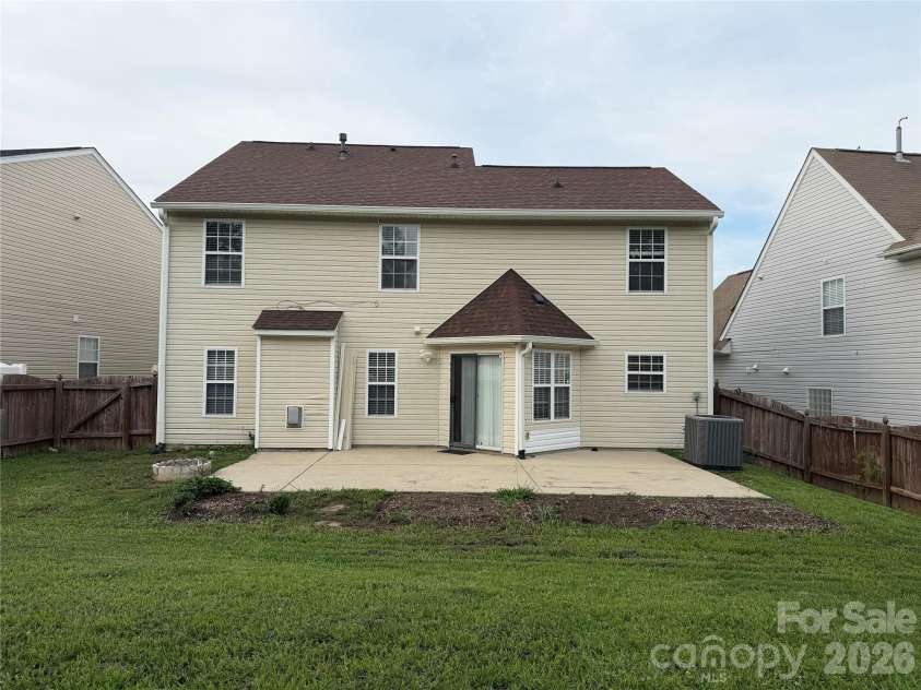 9233 Simonton Drive, Charlotte, NC 28269.  MLS# CAR4384205, YatesRealty ID 26481. Back view