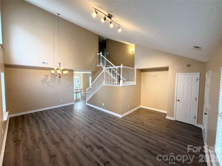 9233 Simonton Drive, Charlotte, NC 28269.  MLS# CAR4384205, YatesRealty ID 26481. Living Room and entrance