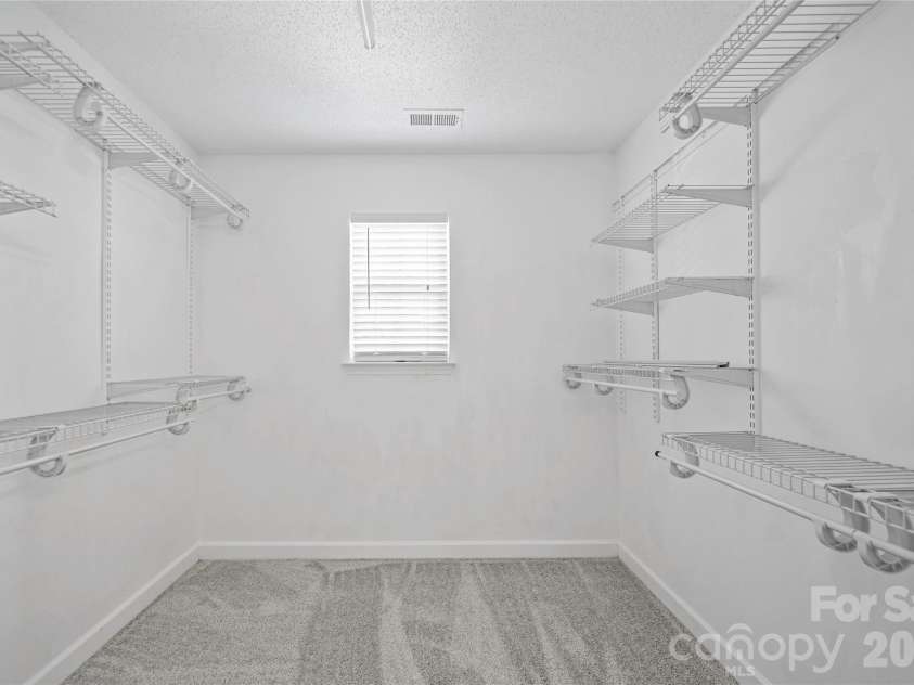 9233 Simonton Drive, Charlotte, NC 28269.  MLS# CAR4384205, YatesRealty ID 26481. Master walk in closet
