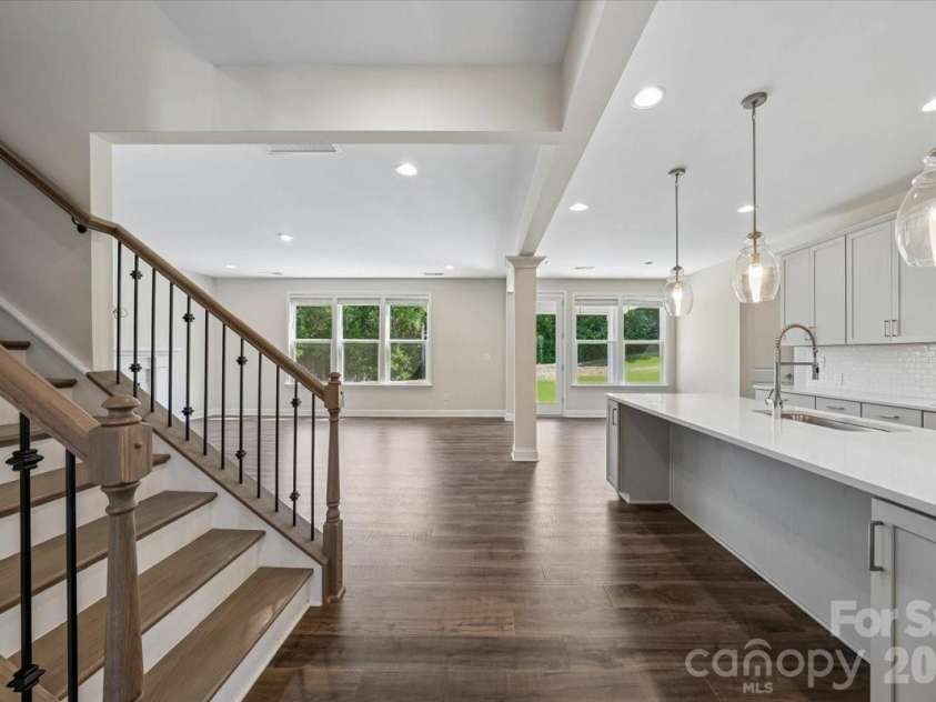 2318 Excalibur Drive, Indian Land, SC 29707.  MLS# CAR4383670, YatesRealty ID 26482. Stairs and Kitchen