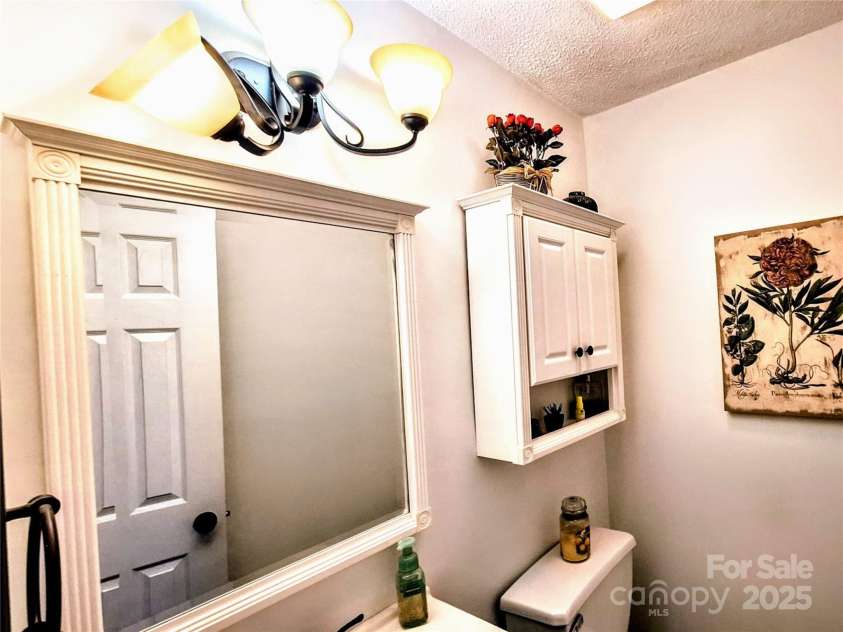 3616 Fair Oaks Place, Concord, NC 28027.  MLS# CAR4275596, YatesRealty ID 26485. Main level half bath