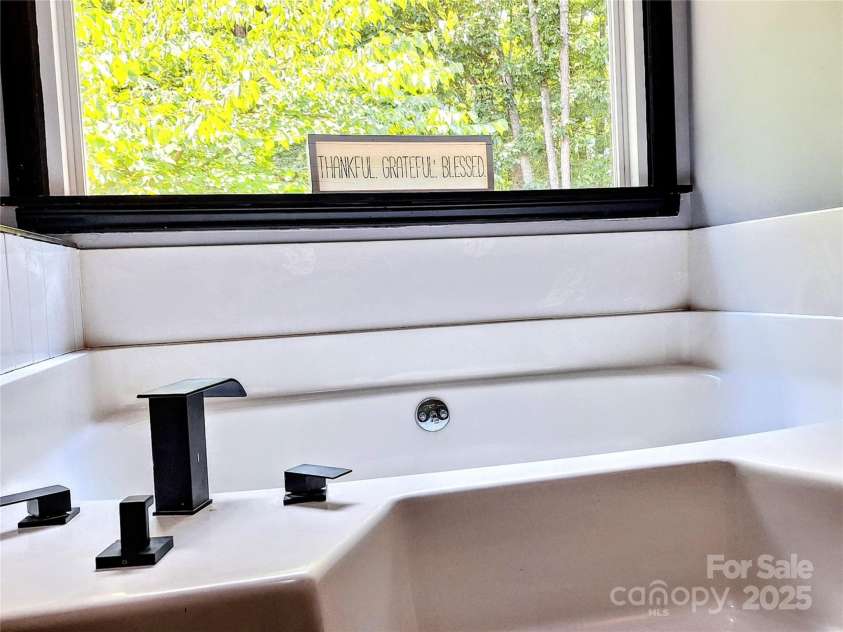 3616 Fair Oaks Place, Concord, NC 28027.  MLS# CAR4275596, YatesRealty ID 26485. Primary features a garden tub and separate shower