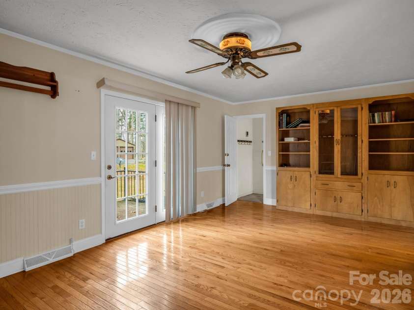136 Old Tanglewood Trail, Hendersonville, NC 28739.  MLS# CAR4324799, YatesRealty ID 26492. Den with exit to basement