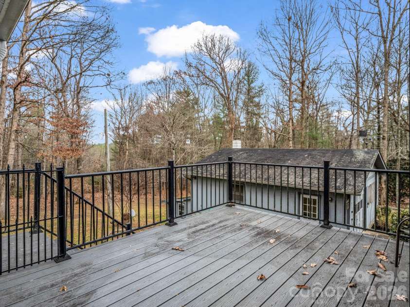 136 Old Tanglewood Trail, Hendersonville, NC 28739.  MLS# CAR4324799, YatesRealty ID 26492. Large deck over lookinging back yard