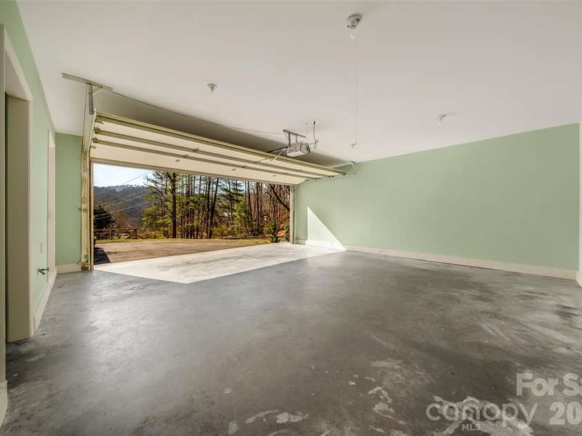 63 Pinecroft Road, Asheville, NC 28804.  MLS# CAR4352217, YatesRealty ID 26495. 2 Car garage with laundry off the kitchen