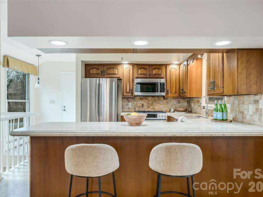 63 Pinecroft Road, Asheville, NC 28804.  MLS# CAR4352217, YatesRealty ID 26495. Kitchen with room for bar seating and breakfast nook