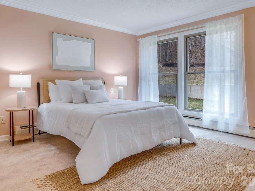 63 Pinecroft Road, Asheville, NC 28804.  MLS# CAR4352217, YatesRealty ID 26495. Light filled primary bedroom