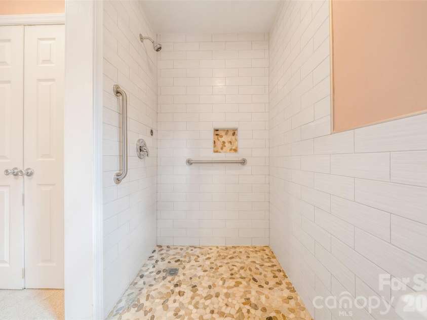 63 Pinecroft Road, Asheville, NC 28804.  MLS# CAR4352217, YatesRealty ID 26495. Primary walk in shower with no threshold