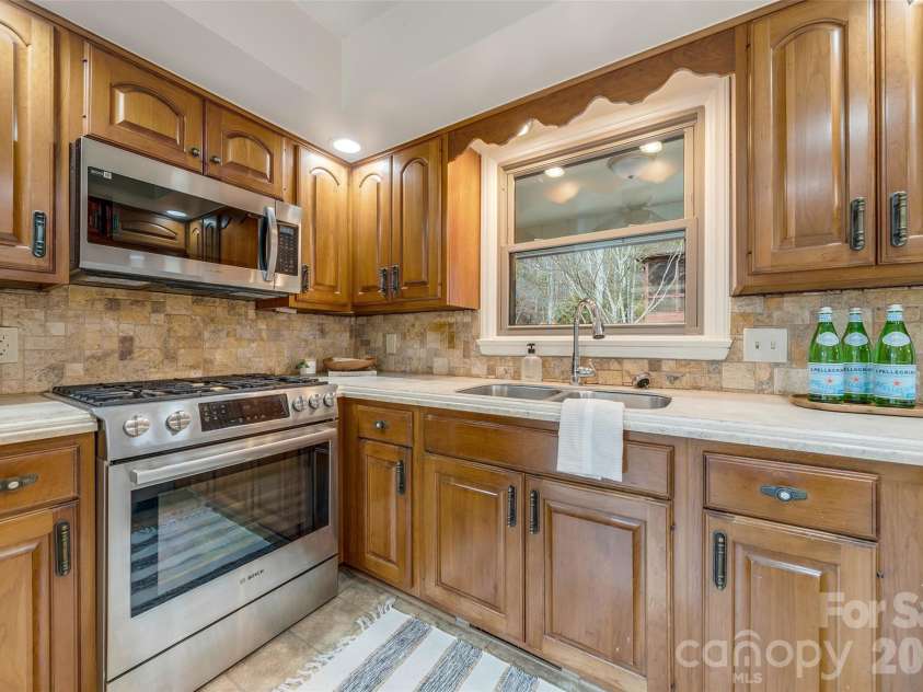 63 Pinecroft Road, Asheville, NC 28804.  MLS# CAR4352217, YatesRealty ID 26495. Spacious Kitchen with lovely window over the sink