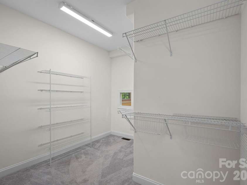 3889 Granite Street, Terrell, NC 28682.  MLS# CAR4367523, YatesRealty ID 26502. Large walk-in closet with laundry chute