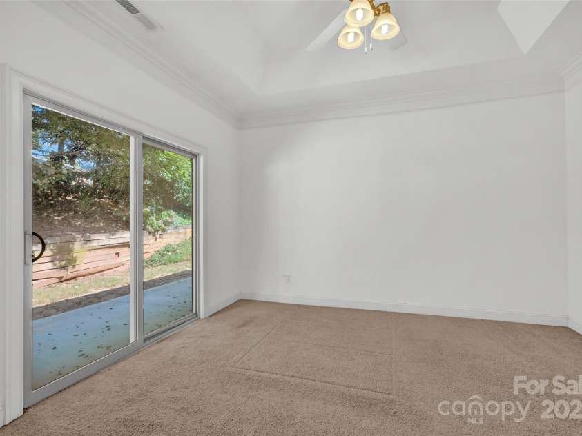 102 Coral Lane, Mooresville, NC 28117.  MLS# CAR4282698, YatesRealty ID 2652. Primary bedroom, sliding door to rear patio