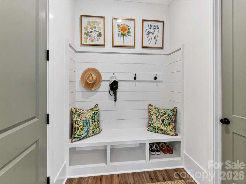 202 Streamwood Road, Troutman, NC 28166.  MLS# CAR4384366, YatesRealty ID 26520. Functional drop zone features built-in bench seating, storage cubbies, and stylish shiplap detailing, creating the perfect everyday organization space for coats, shoes, and bags.
