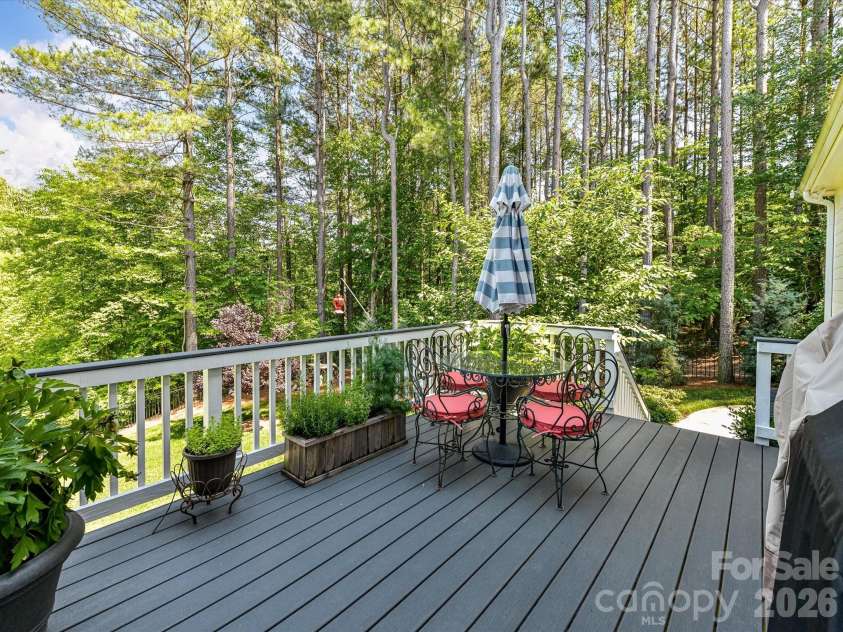 202 Streamwood Road, Troutman, NC 28166.  MLS# CAR4384366, YatesRealty ID 26520. Relax and unwind on the spacious back deck overlooking a private wooded backyard, offering the perfect setting for outdoor dining, entertaining, or peaceful mornings surrounded by nature.