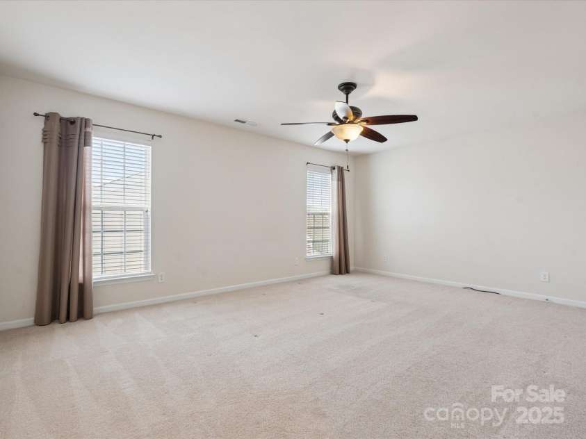 8036 Crater Lake Drive, Fort Mill, SC 29707.  MLS# CAR4271069, YatesRealty ID 26525. Second level bedroom with walk-in-closet