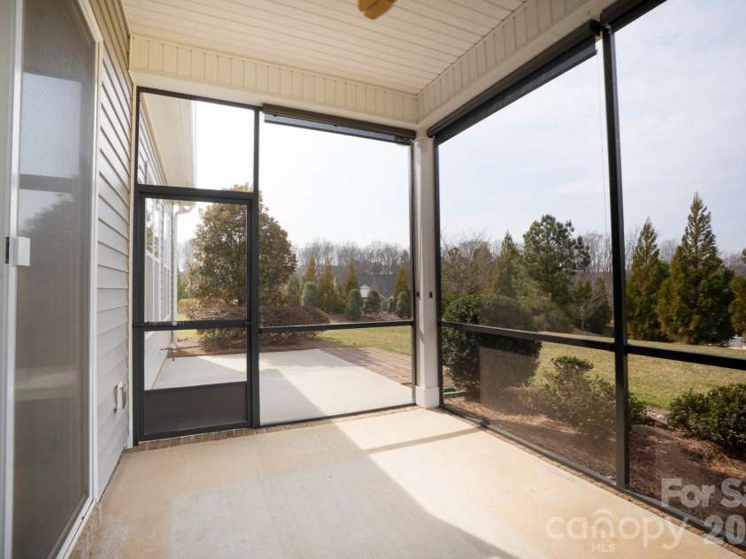13003 Riley Grace Lane, Cornelius, NC 28031.  MLS# CAR4340809, YatesRealty ID 26526. Screened Porch overlooking private yard