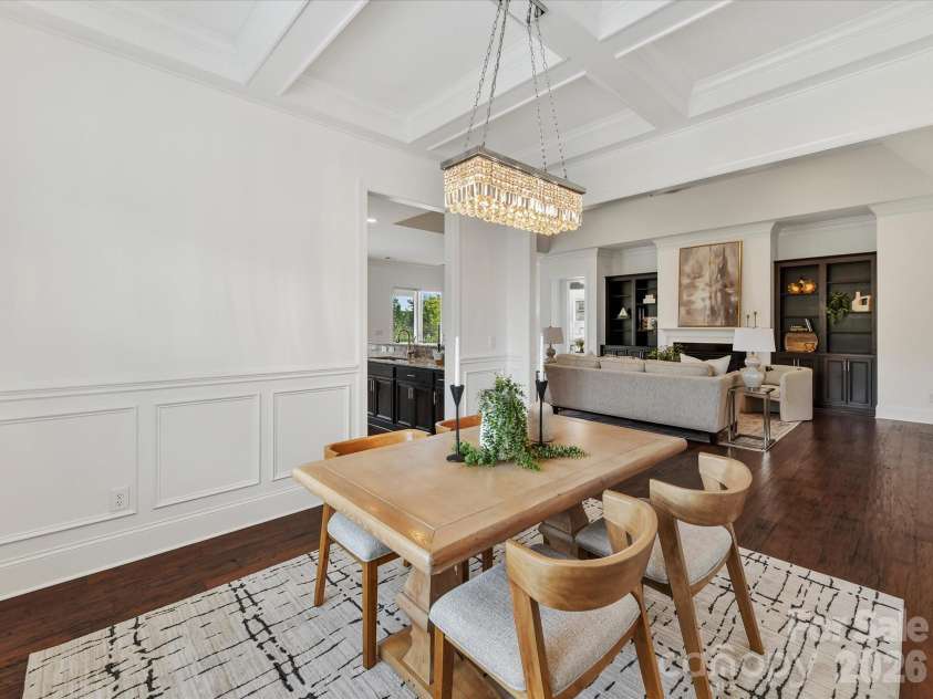 13003 Riley Grace Lane, Cornelius, NC 28031.  MLS# CAR4418120, YatesRealty ID 26526. Elegant dining room features beautiful flooring, detailed wainscoting, a coffered ceiling and statement lighting with an open flow to the main living areas.