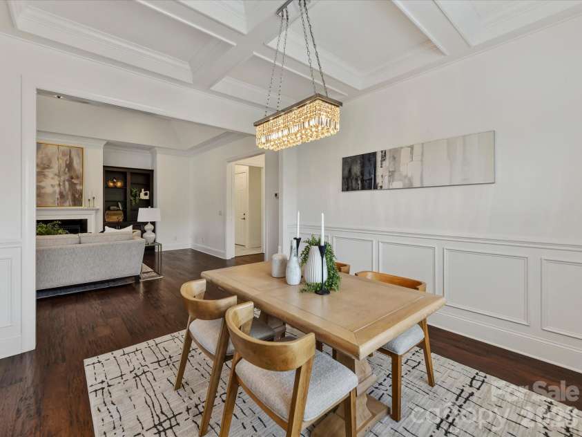 13003 Riley Grace Lane, Cornelius, NC 28031.  MLS# CAR4418120, YatesRealty ID 26526. Elegant dining room features beautiful flooring, detailed wainscoting, a coffered ceiling and statement lighting with an open flow to the main living areas.