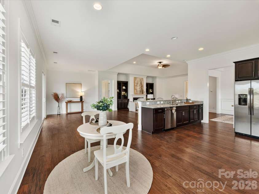 13003 Riley Grace Lane, Cornelius, NC 28031.  MLS# CAR4418120, YatesRealty ID 26526. Kitchen flows seamlessly into the bright breakfast nook, where abundant windows and open sightlines create an inviting space for casual dining.