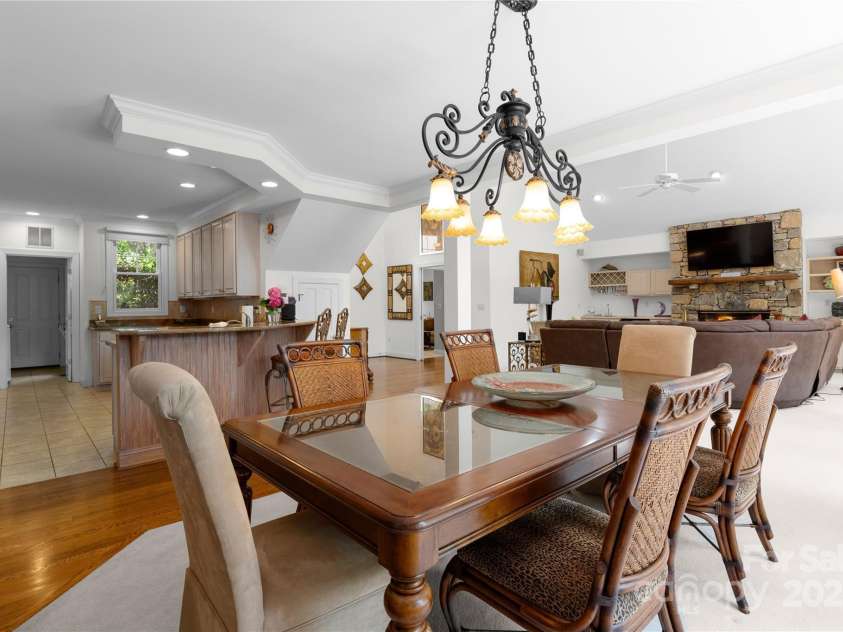 196 Pine Shadow Drive, Hendersonville, NC 28739.  MLS# CAR4274767, YatesRealty ID 26527. Dining room looking toward kitchen/greatroom