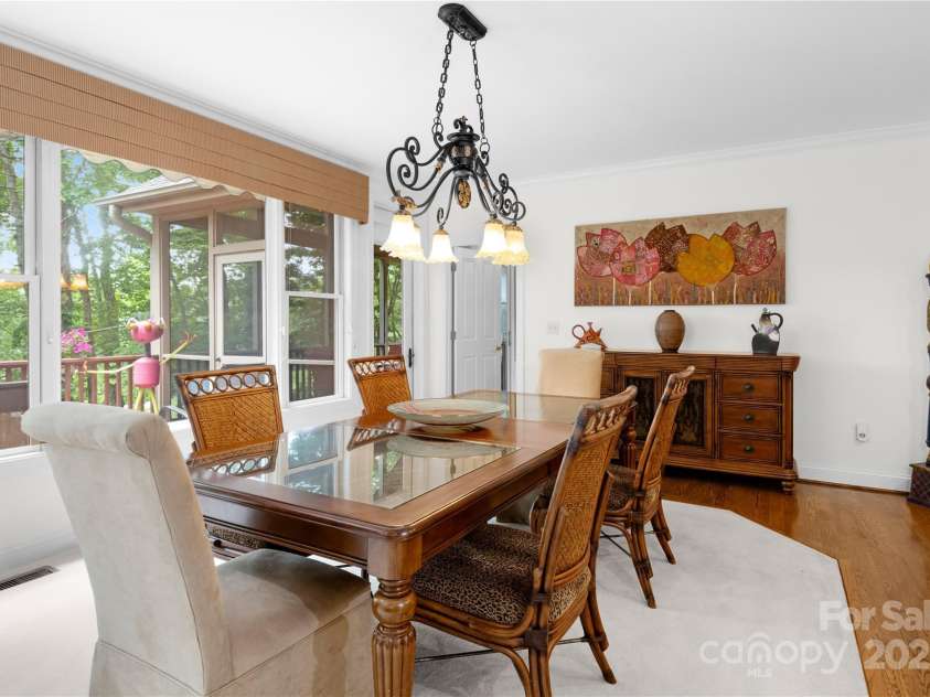 196 Pine Shadow Drive, Hendersonville, NC 28739.  MLS# CAR4274767, YatesRealty ID 26527. Dining room looking toward screen porch