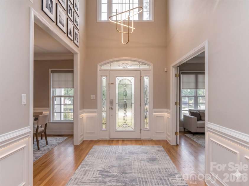 6167 Four Wood Drive, Matthews, NC 28104.  MLS# CAR4383205, YatesRealty ID 26529. Foyer Virtually Staged