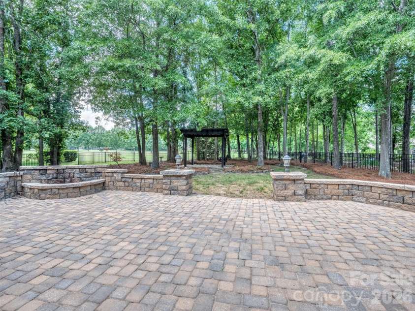 6167 Four Wood Drive, Matthews, NC 28104.  MLS# CAR4383205, YatesRealty ID 26529. Huge Paver Patio with Fire Pit
