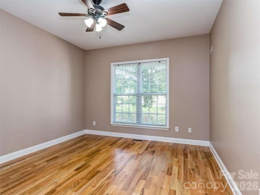 6167 Four Wood Drive, Matthews, NC 28104.  MLS# CAR4383205, YatesRealty ID 26529. Main Floor Guest Room
