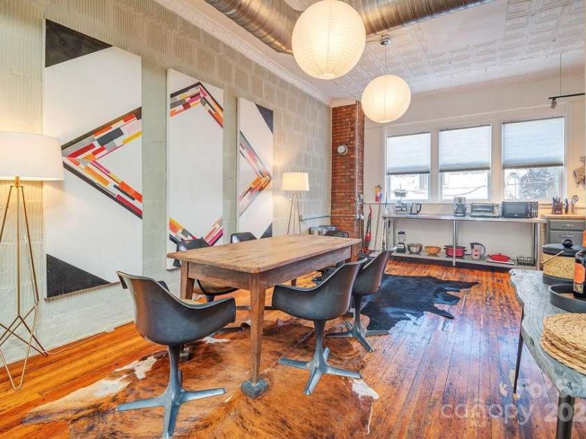 33 Carolina Lane, Asheville, NC 28801.  MLS# CAR4277865, YatesRealty ID 26531. Oversized dining room, pouring with light and a city view.