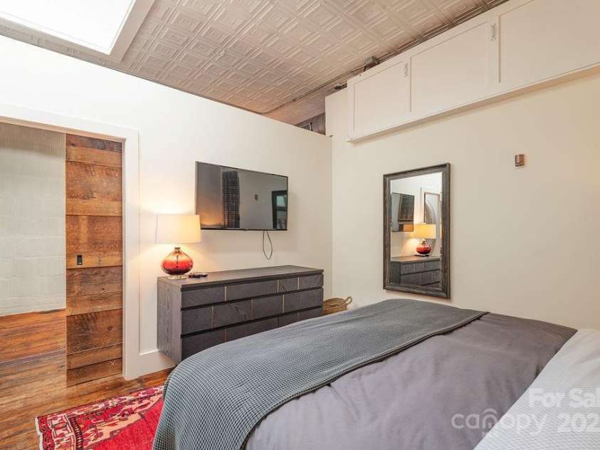 33 Carolina Lane, Asheville, NC 28801.  MLS# CAR4277865, YatesRealty ID 26531. Privacy w/ barn door, but open ceilings to give lofty feel. Storage above w/ additional closet.