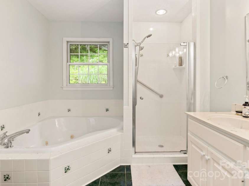 32 Tucker Road, Black Mountain, NC 28711.  MLS# CAR4275444, YatesRealty ID 26535. Primary bathroom