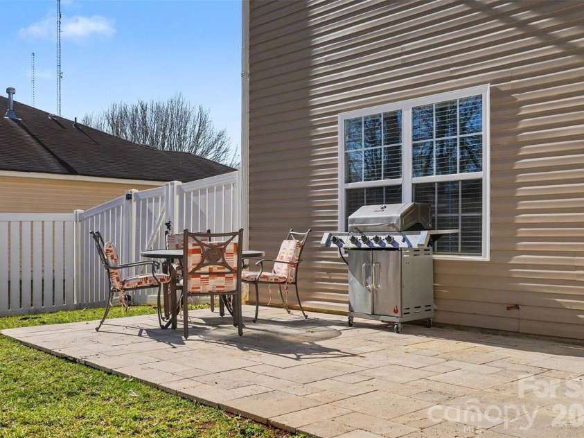 11001 Dulin Creek Boulevard, Charlotte, NC 28215.  MLS# CAR4287097, YatesRealty ID 26536. Rear Travertine Deck
