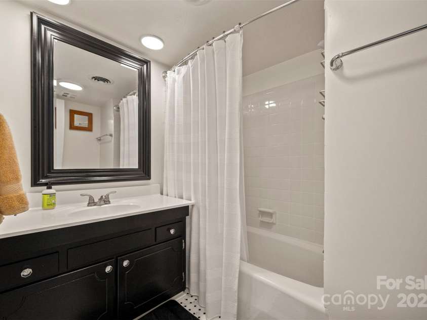 305 Grady Avenue, Tryon, NC 28782.  MLS# CAR4233461, YatesRealty ID 2654. Guest Bath