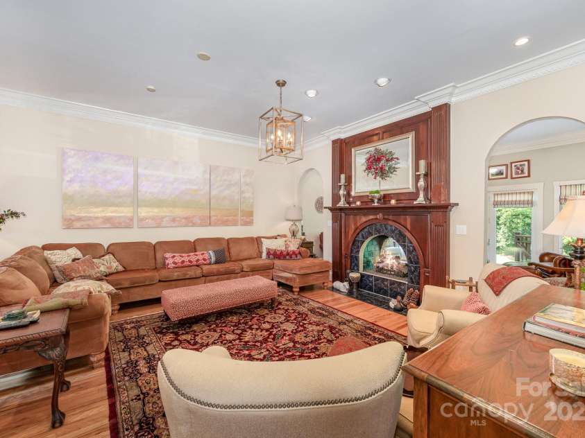 408 Johnsfield Road, Shelby, NC 28150.  MLS# CAR4269402, YatesRealty ID 26543. Beautiful family room with lovely arched entryways and the other side of the peep-through fireplace