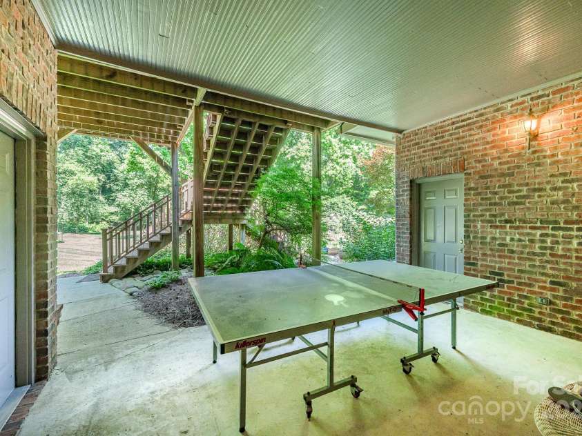 408 Johnsfield Road, Shelby, NC 28150.  MLS# CAR4269402, YatesRealty ID 26543. Covered patio off the basement