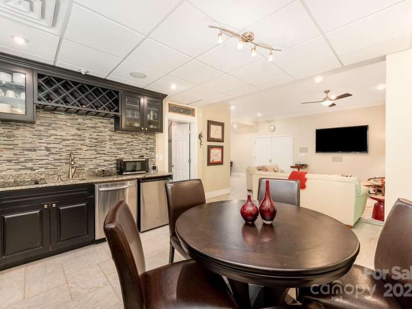 408 Johnsfield Road, Shelby, NC 28150.  MLS# CAR4269402, YatesRealty ID 26543. Kitchen and dining area in the basement!