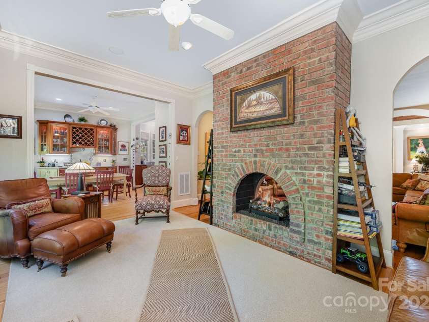 408 Johnsfield Road, Shelby, NC 28150.  MLS# CAR4269402, YatesRealty ID 26543. The bright sunroom has a peep-through fireplace into the family room.