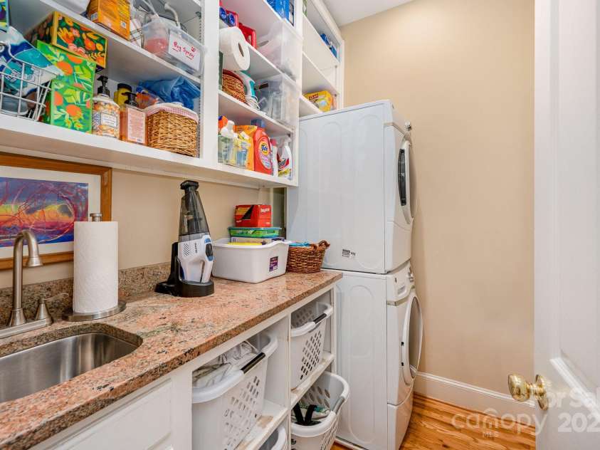 408 Johnsfield Road, Shelby, NC 28150.  MLS# CAR4269402, YatesRealty ID 26543. The laundry room on the main floor offers plenty of counter space and storage.