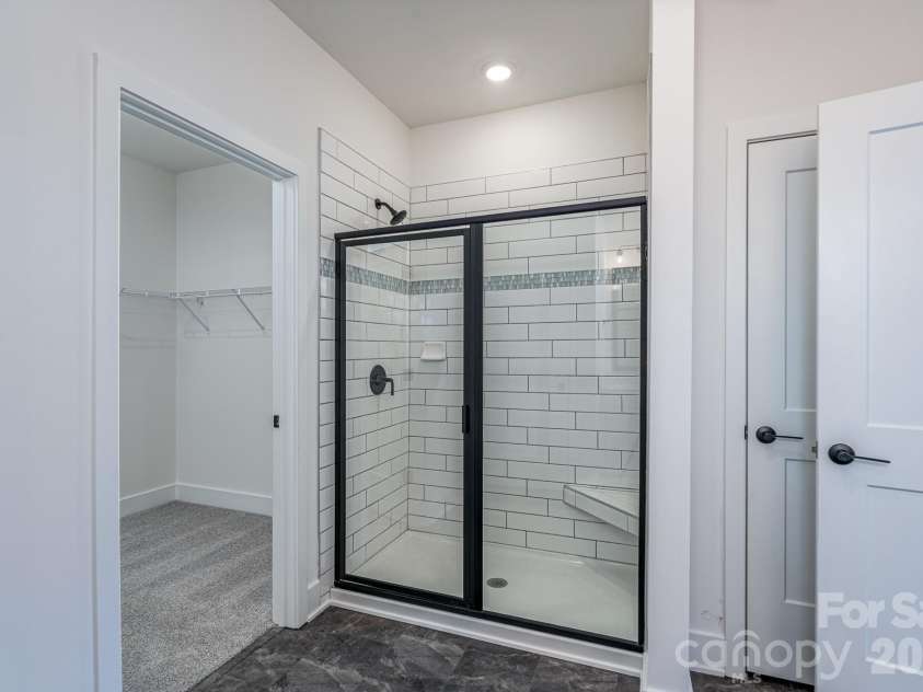 1250 Gardenia Drive, Mt Ulla, NC 28125.  MLS# CAR4365465, YatesRealty ID 26547. 5ft tiled shower in primary bath