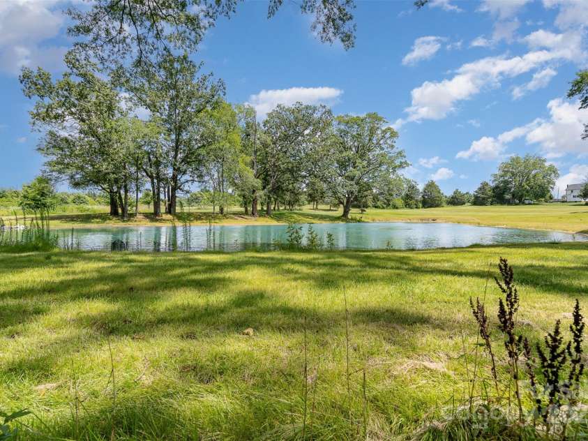 135 Oak Creek Drive, Rockwell, NC 28138.  MLS# CAR4269550, YatesRealty ID 26550. Pond is on neighbor's property