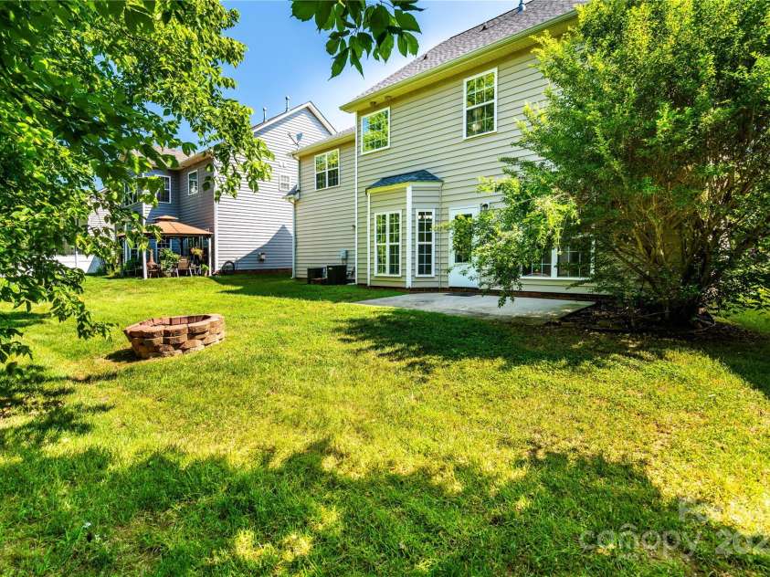 119 Tilton Drive, Mooresville, NC 28115.  MLS# CAR4274141, YatesRealty ID 26551. Back yard alt angle