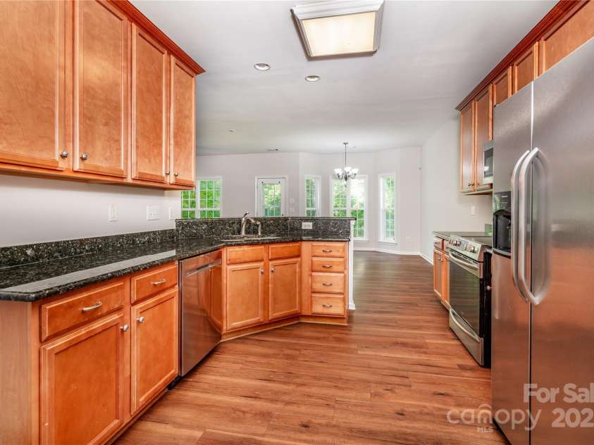 119 Tilton Drive, Mooresville, NC 28115.  MLS# CAR4274141, YatesRealty ID 26551. Kitchen into dining area