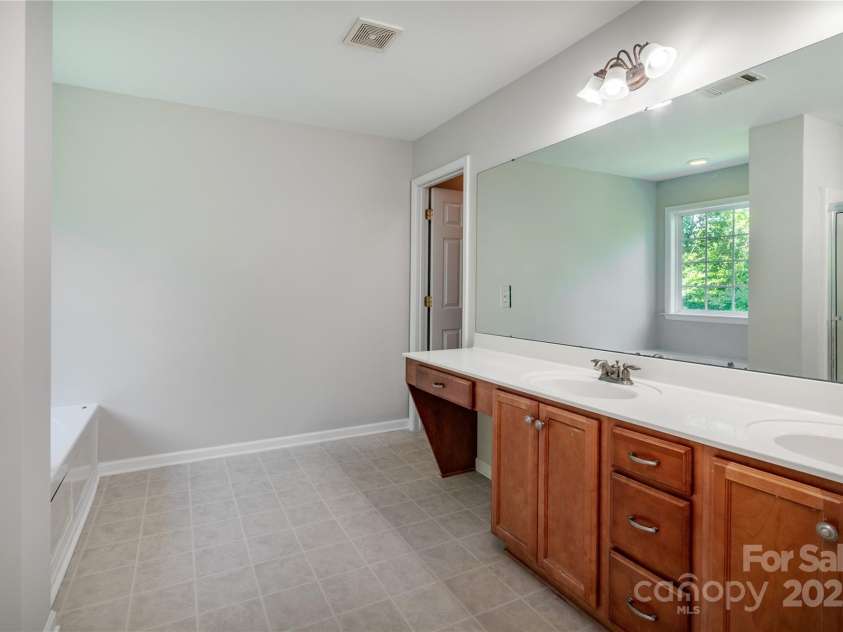119 Tilton Drive, Mooresville, NC 28115.  MLS# CAR4274141, YatesRealty ID 26551. Primary bathroom