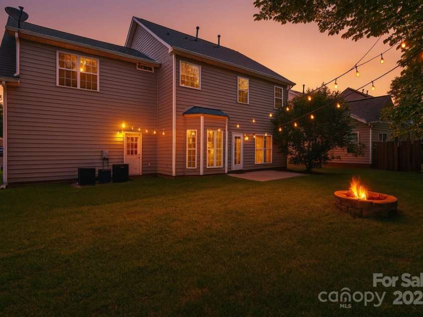 119 Tilton Drive, Mooresville, NC 28115.  MLS# CAR4274141, YatesRealty ID 26551. Virtually staged private back yard/patio