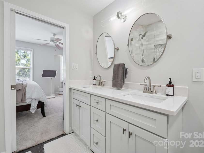 8412 Townley Road, Huntersville, NC 28078.  MLS# CAR4281969, YatesRealty ID 26554. Dual Quartz Vanity with Designer Mirrors and Lighting.