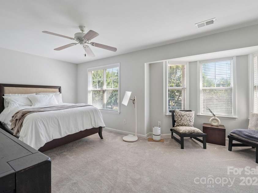 8412 Townley Road, Huntersville, NC 28078.  MLS# CAR4281969, YatesRealty ID 26554. Luxurious Primary Suite with Bay Window Seating Area.