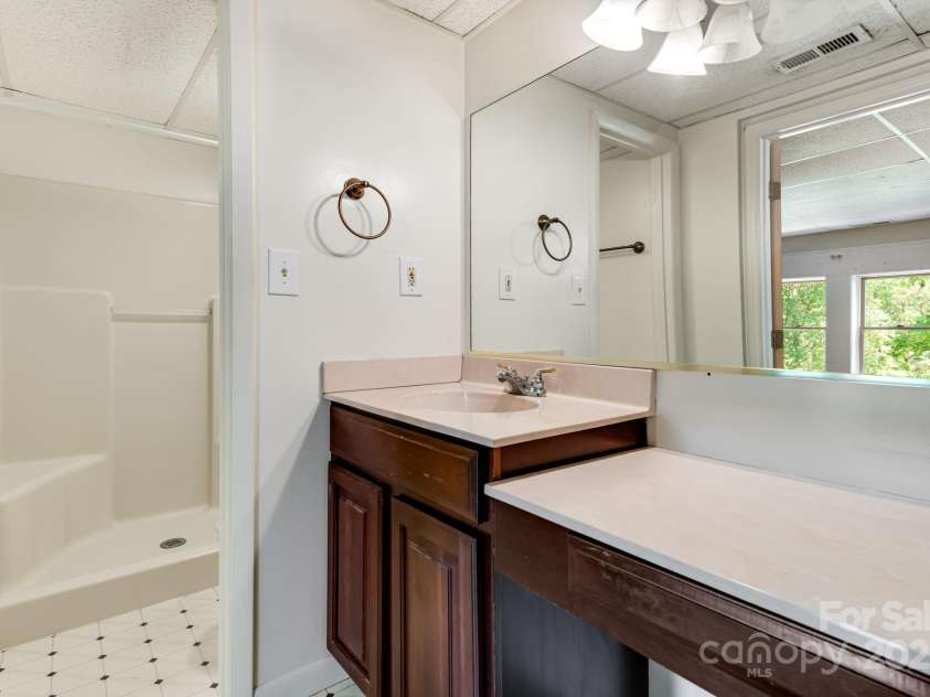 1360 Jupiter Road, Weaverville, NC 28787.  MLS# CAR4276296, YatesRealty ID 26556. Basement Apartment Primary Bathroom