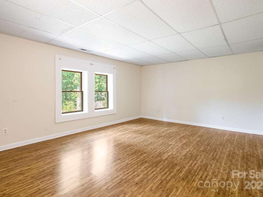 1360 Jupiter Road, Weaverville, NC 28787.  MLS# CAR4276296, YatesRealty ID 26556. Basement Apartment Primary Bedroom