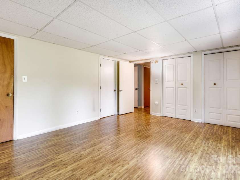 1360 Jupiter Road, Weaverville, NC 28787.  MLS# CAR4276296, YatesRealty ID 26556. Basement Apartment Primary Bedroom