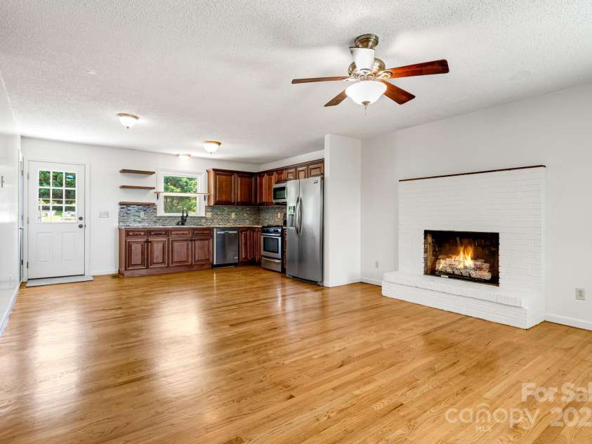 1360 Jupiter Road, Weaverville, NC 28787.  MLS# CAR4276296, YatesRealty ID 26556. Open Living Room and Kitchen Main Floor